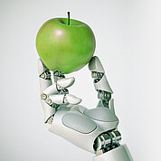 Robotic hand holding an apple 3d rendering, gmo concept, automation concept